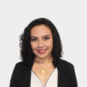 The professor of the School of Education, Jenny Patricia Acevedo Rincón, is presented to the general public and the educational community. The photo was taken in close-up, with a white background, and the professor is positioned in the center.