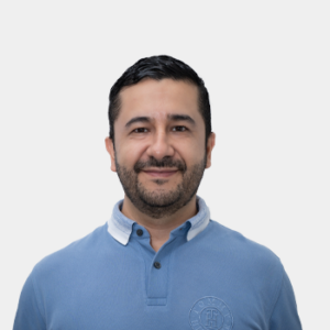 The photo was taken in the foreground, white background and Professor Andrés Giovanni González Hernández is in the center.