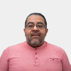 The photo was taken in close-up, on a white background, with the professor Angel Manuel Melendez in the center.