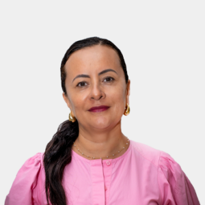 The photo was taken in the foreground, white background and Professor Sandra Judith Garcia is located in the center.