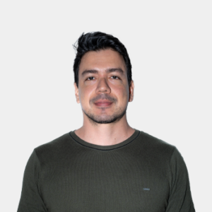 The photo was taken in the foreground, white background and the teacher Javier Ferney Ochoa is located in the centre.