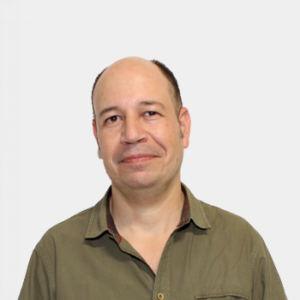 The photo was taken in the foreground, white background and the teacher Alfonso Antonio Fernandez is located in the centre.
