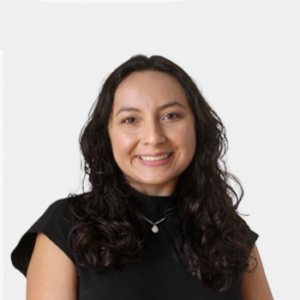The photo was taken in the foreground, white background and the teacher Alicia Natali Chamorro is located in the centre.