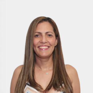 The photo was taken in the foreground, white background and the teacher Ana Milena Renhans is located in the centre.