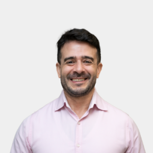 The photo was taken in the foreground, white background and the teacher Andres Botero Bernal is located in the centre.