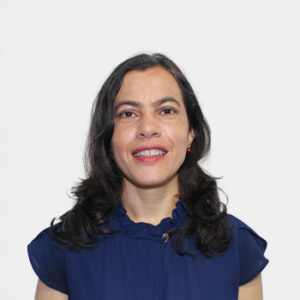 The photo was taken in the foreground, white background and the teacher Brenda Escobar is located in the centre.