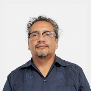 The photo was taken in the foreground, white background and the teacher Helwar Fernando Figueroa is located in the centre.