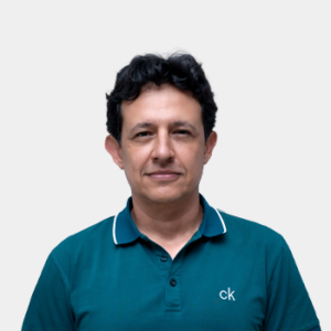 The photo was taken in the foreground, white background and the teacher Javier Mauricio Martinez is located in the centre.