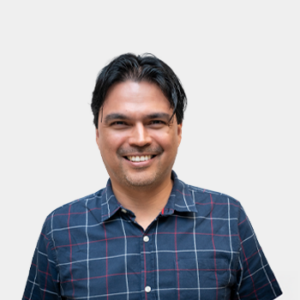 The photo was taken in the foreground, white background and the teacher John Jairo Marquez is located in the centre.