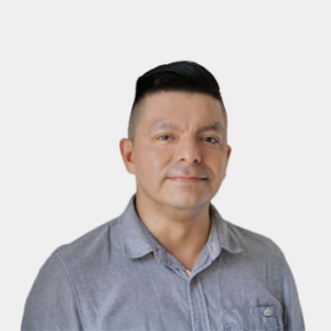The photo was taken in the foreground, white background and the teacher Milton Fernando Dionicio is located in the centre.