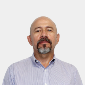 The photo was taken in the foreground, white background and the teacher Nectali Ariza Ariza is located in the centre.