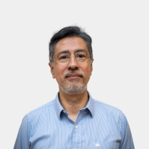The photo was taken in the foreground, white background and the teacher Oscar Javier Begambre is located in the centre.